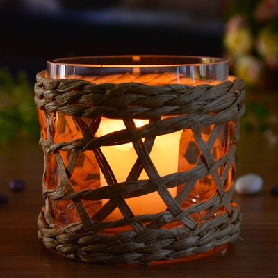 kualitas Round Creative Glass Candle Holders With Wicker Sleeve pabrik